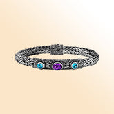 Handcrafted silver woven bracelet with blue and purple quartz stones in Balinese design.